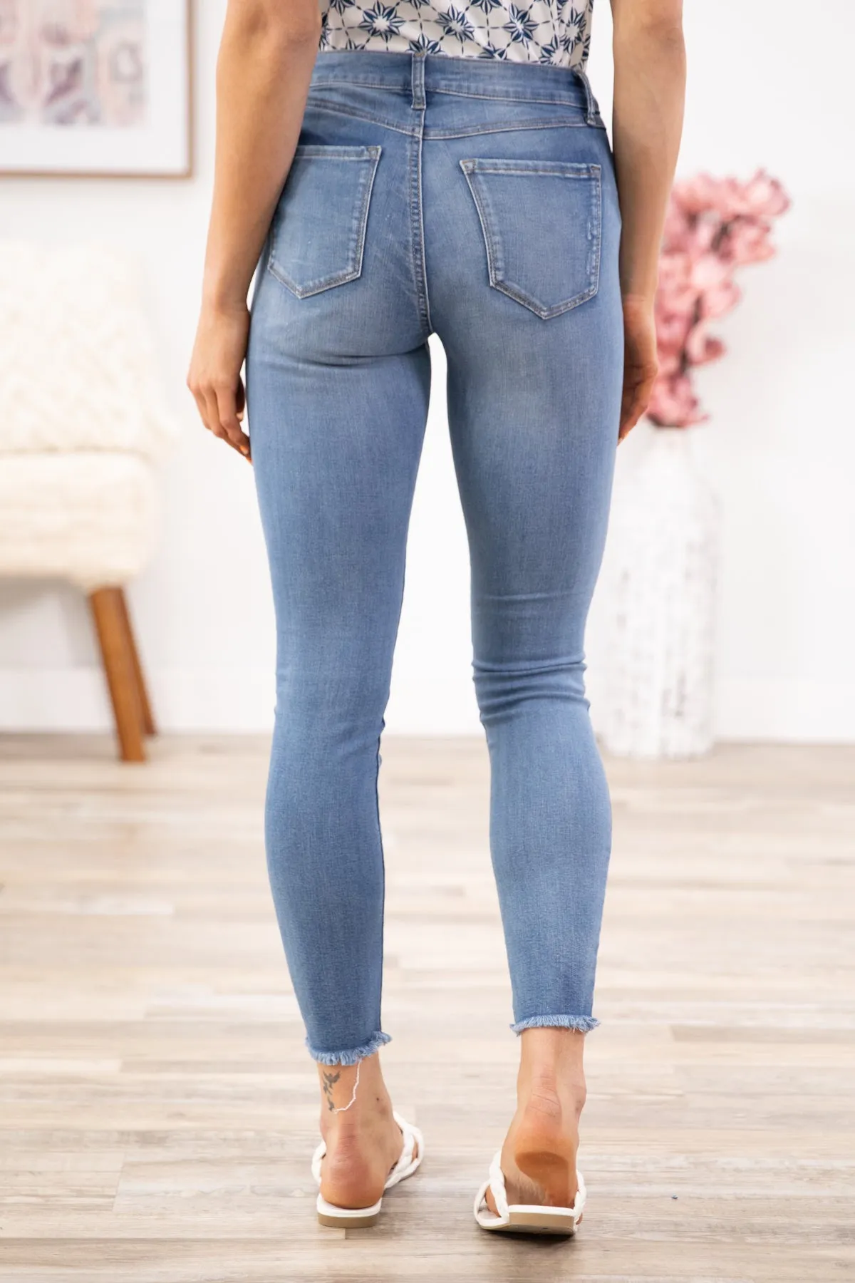 Medium Wash Distressed Hem Mid Rise Jeggings