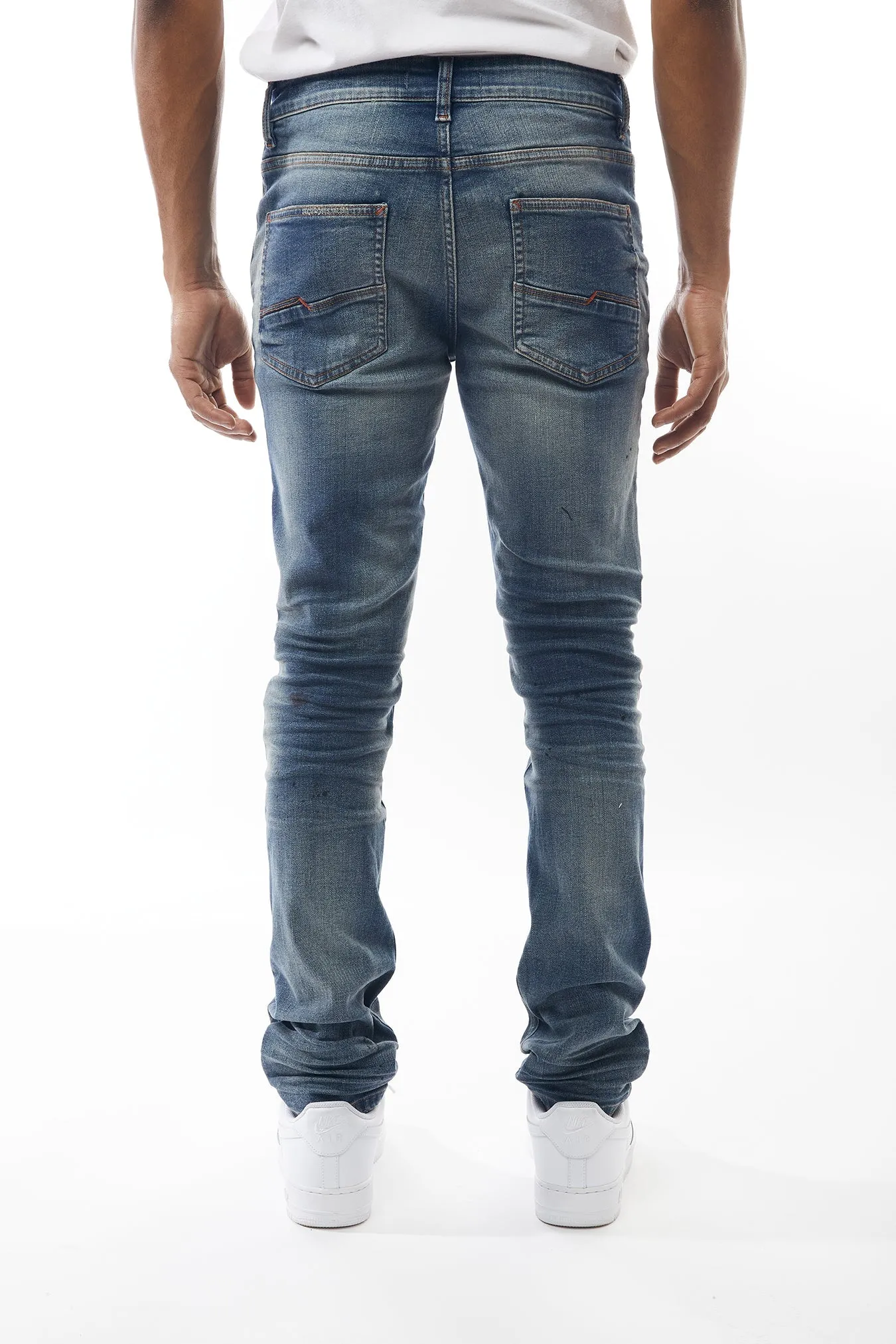Ripped and Repaired Denim Jeans in Hazy