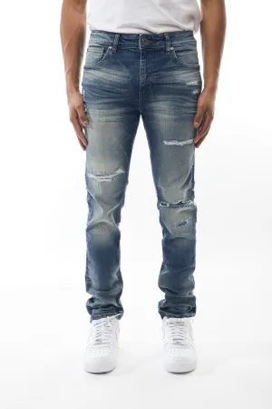 Ripped and Repaired Denim Jeans in Hazy