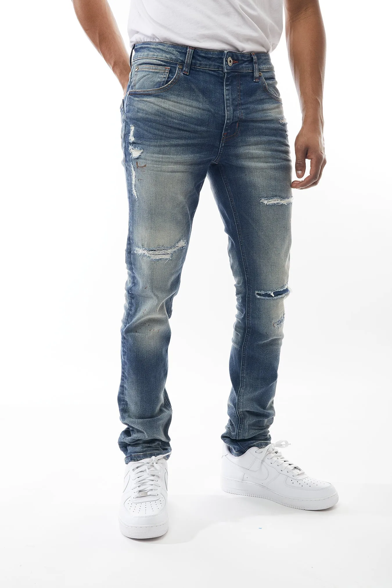 Ripped and Repaired Denim Jeans in Hazy