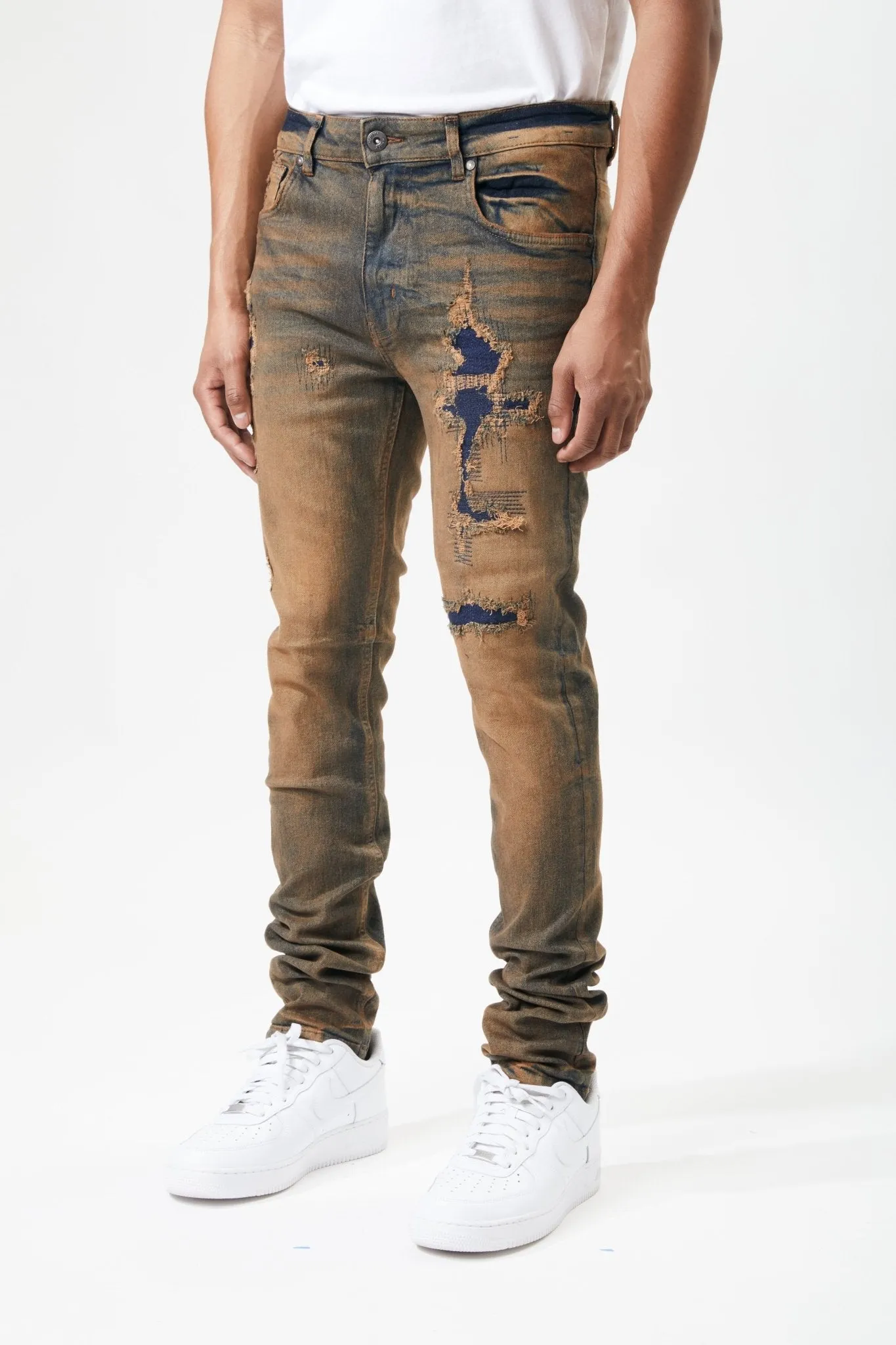Ripped and Repaired Denim Jeans in Timber