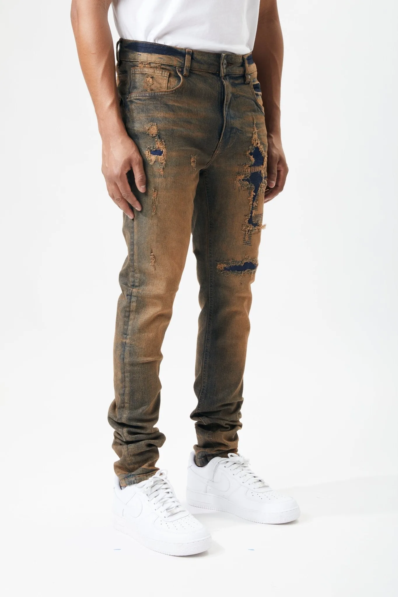 Ripped and Repaired Denim Jeans in Timber