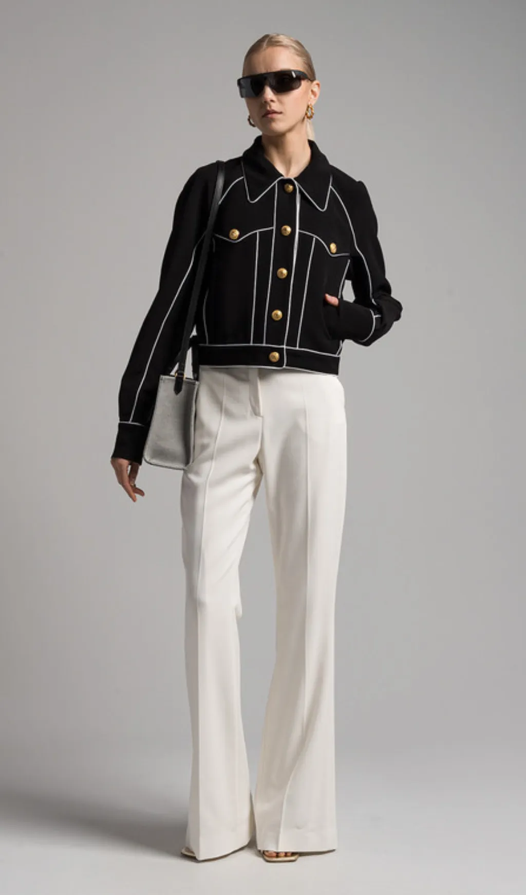 seven-button black piped-trim jacket