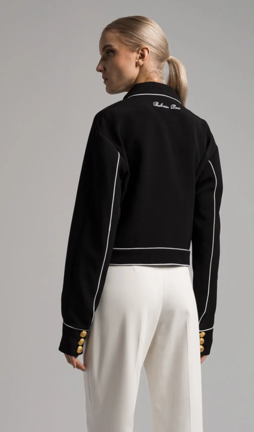 seven-button black piped-trim jacket